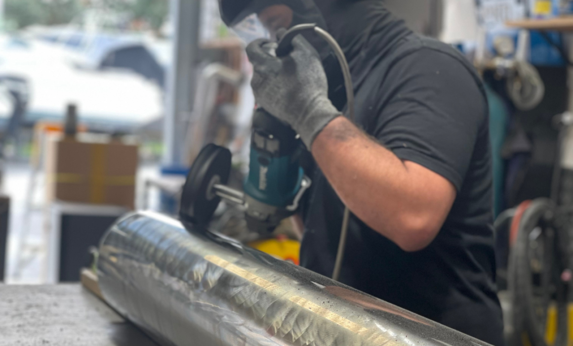 Stainless Steel Fabricator polishing a pedestal base in Auckland nz