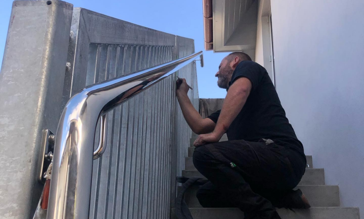 Stainless Steel Marine Fabricator Auckland installing handrail